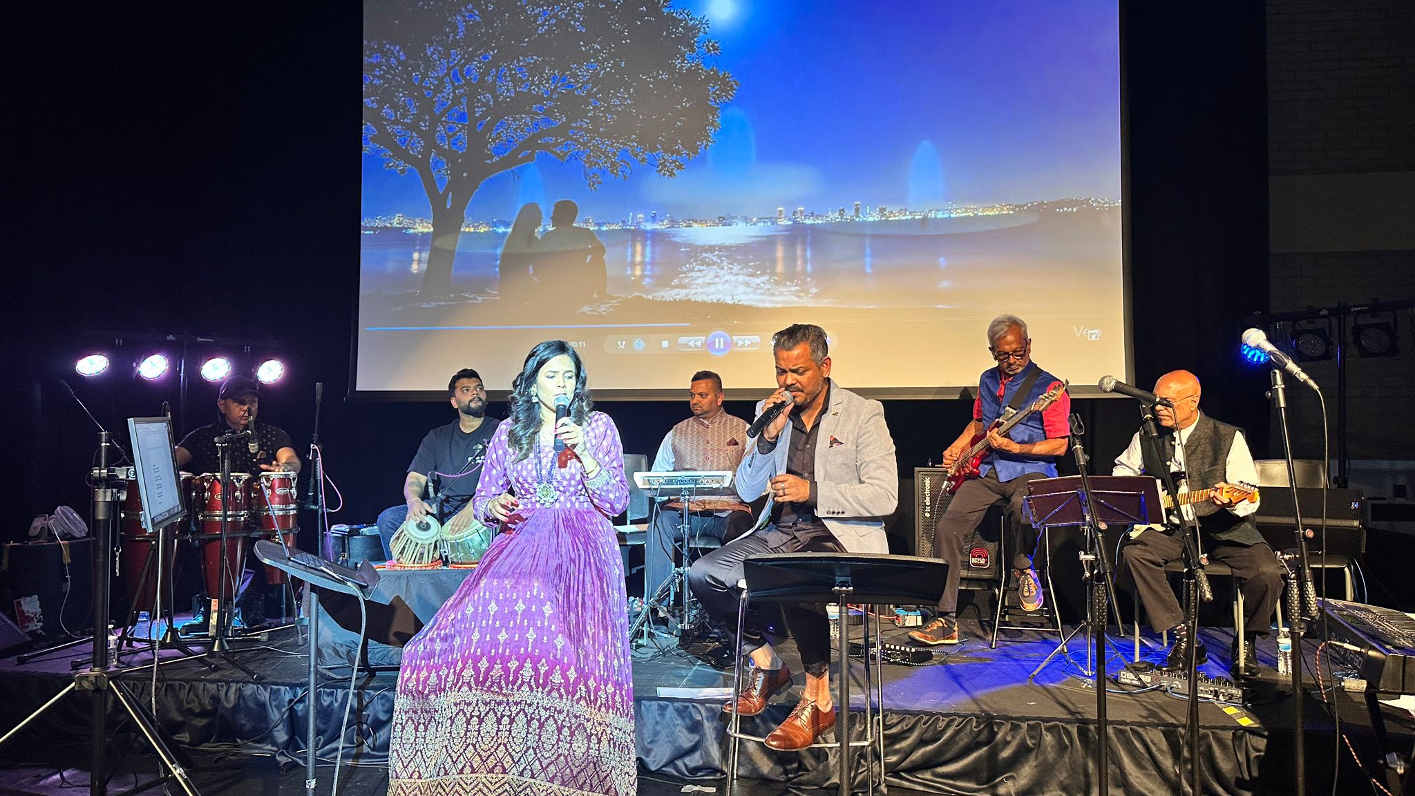 Singers and musicians performing together