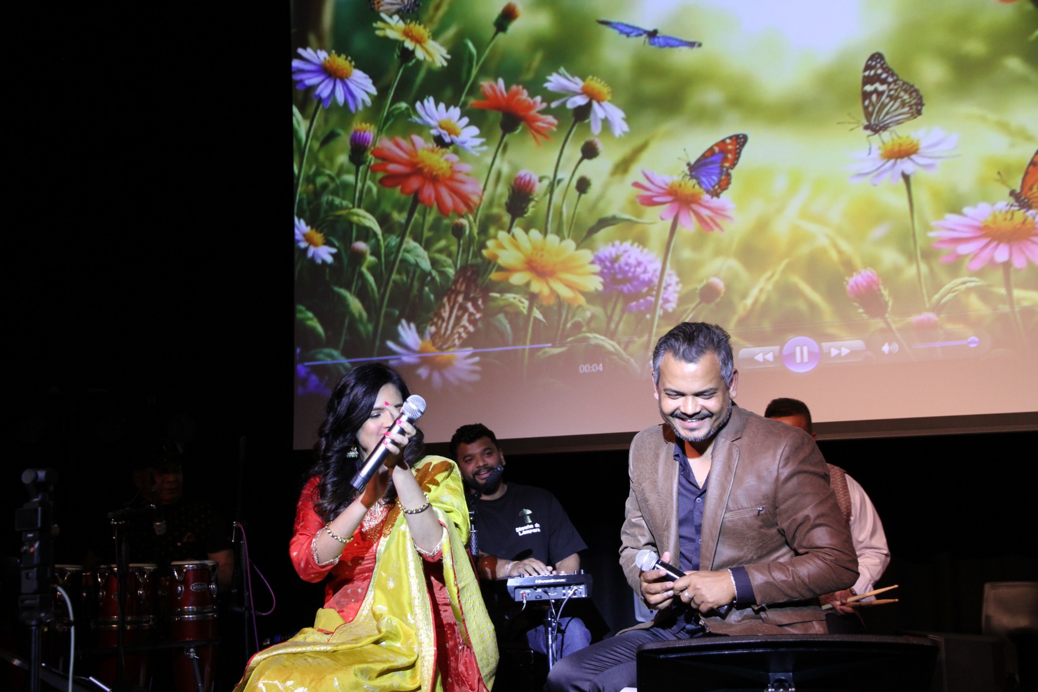 Singers performing together on stage